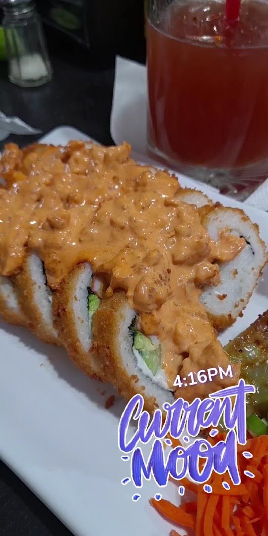 Seafood platter with bright sauces and garnish.
